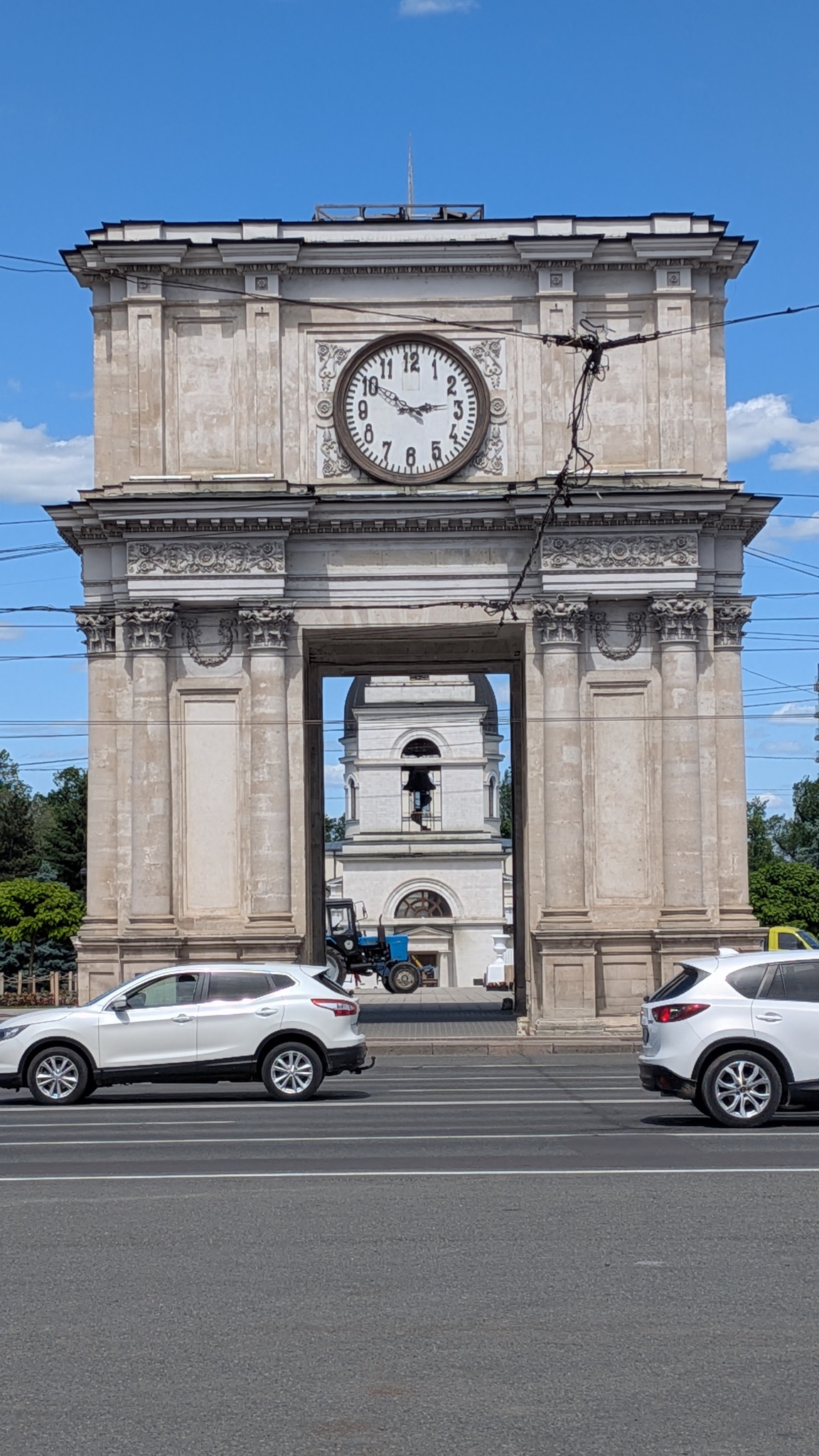 The Triumphal Arch in Chisinau with its clock tower, a miniature version of the Arc de Triomphe in Paris
